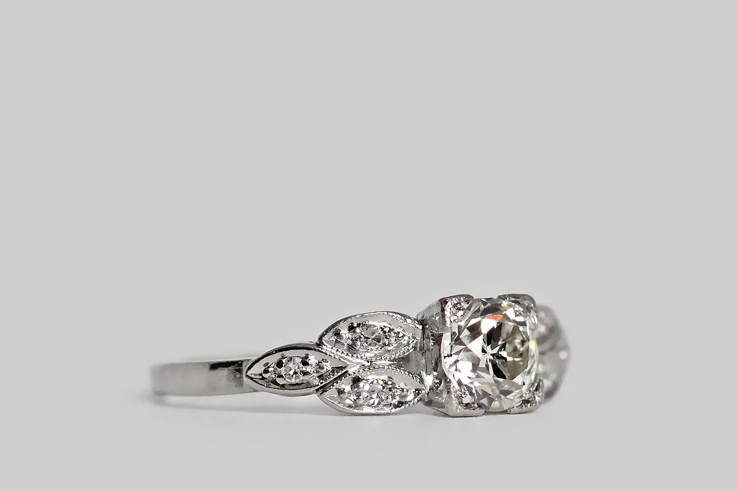 Mid 20th Century OEC Diamond Engagement Ring with Marquise Trios in Platinum